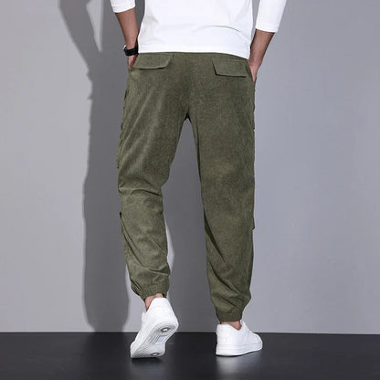 Men's corduroy overalls with ankle-tied loose fit and multi-pocket design, available in a range of autumnal colours