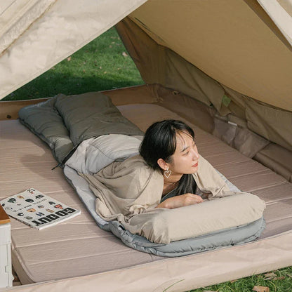 Premium cotton sleeping bag liner in green, featuring a soft, breathable, and comfortable design for travel and camping