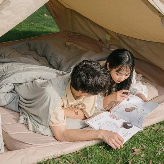 Premium cotton sleeping bag liner in green, featuring a soft, breathable, and comfortable design for travel and camping