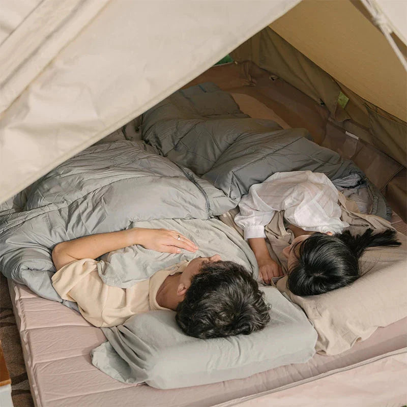 Premium cotton sleeping bag liner in green, featuring a soft, breathable, and comfortable design for travel and camping
