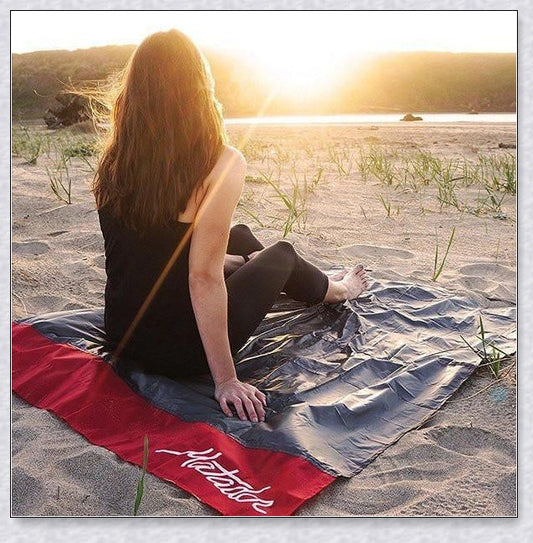 Premium pocket blanket with water-repellent and puncture-resistant design, perfect for outdoor adventures and picnics