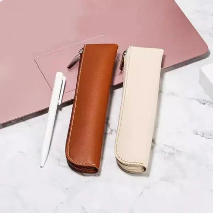 A sleek and sophisticated PU leather pencil case with a secure zipper closure, perfect for organising writing essentials for school and office use.