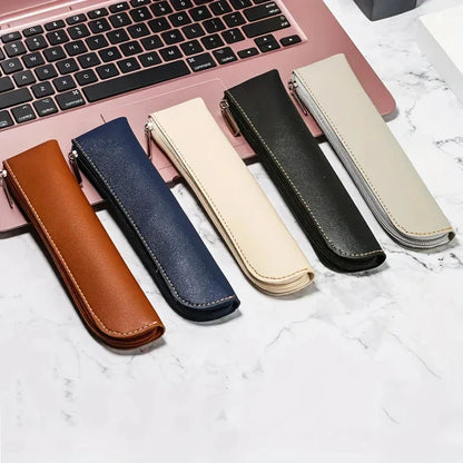 A sleek and sophisticated PU leather pencil case with a secure zipper closure, perfect for organising writing essentials for school and office use.