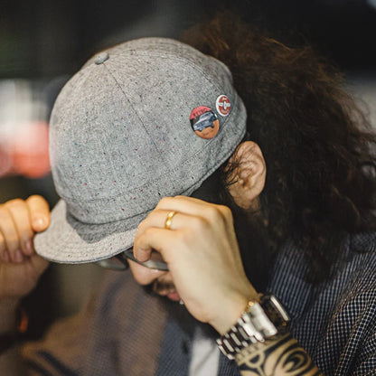 A stylish flat brim peaked cap made of premium polyester fiber, perfect for any season in the UK.