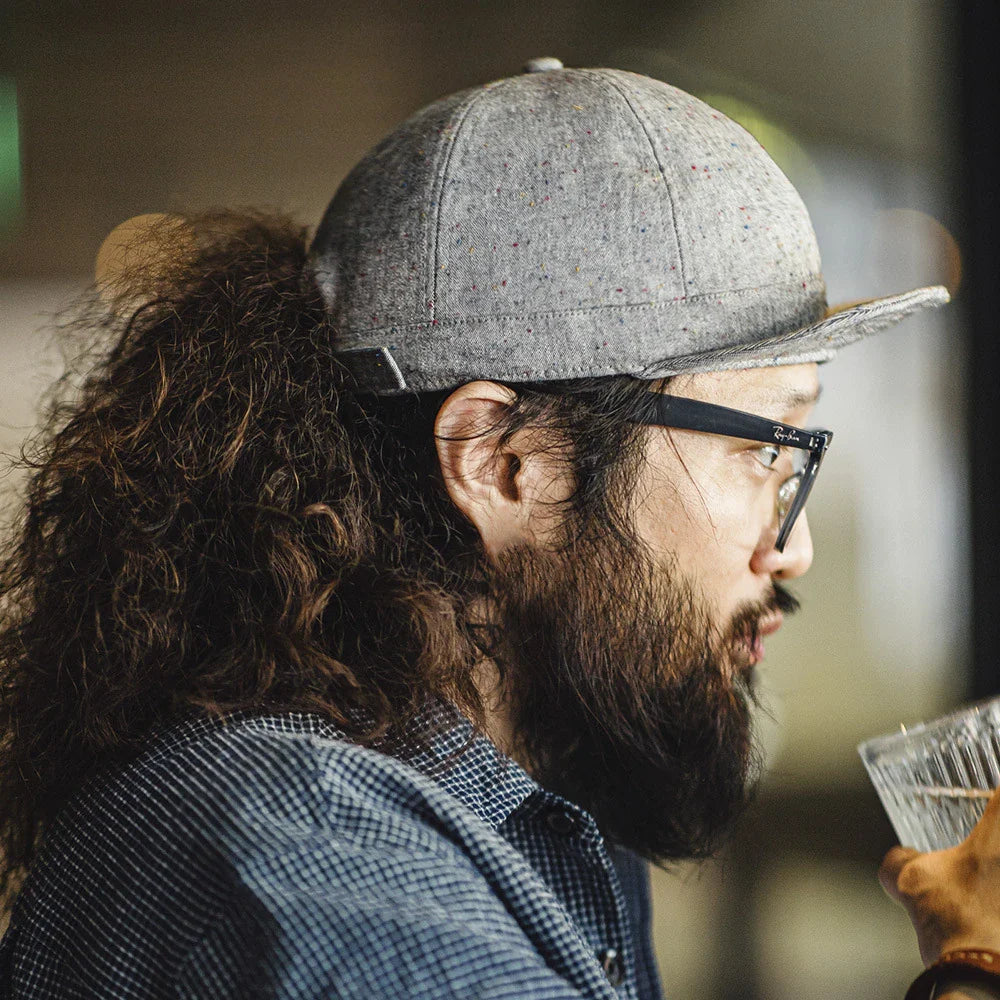 A stylish flat brim peaked cap made of premium polyester fiber, perfect for any season in the UK.