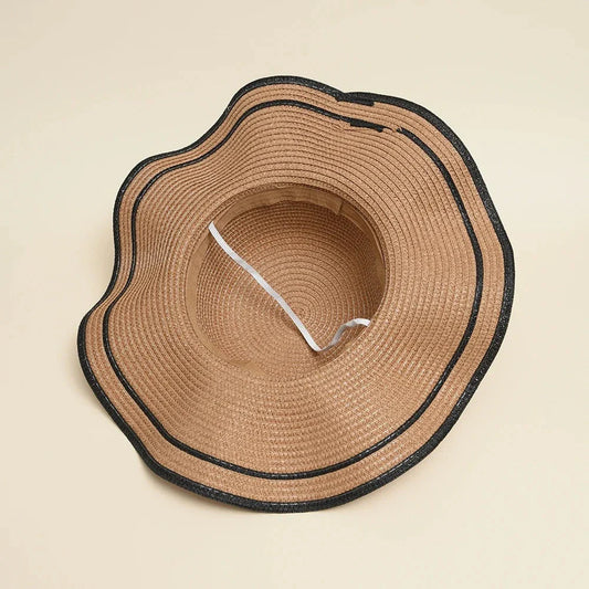A stylish bowknot straw sun hat providing excellent UV protection and comfort for summer adventures