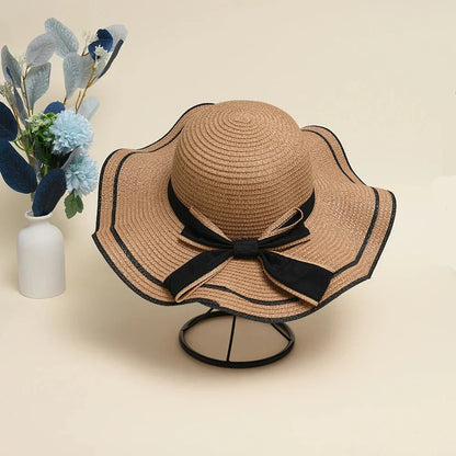 A stylish bowknot straw sun hat providing excellent UV protection and comfort for summer adventures