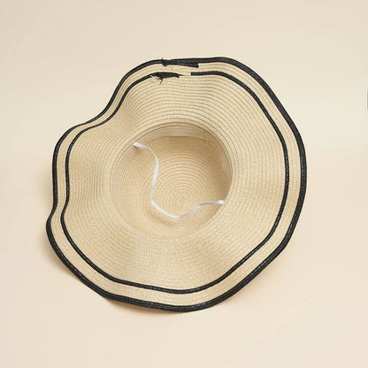 A stylish bowknot straw sun hat providing excellent UV protection and comfort for summer adventures