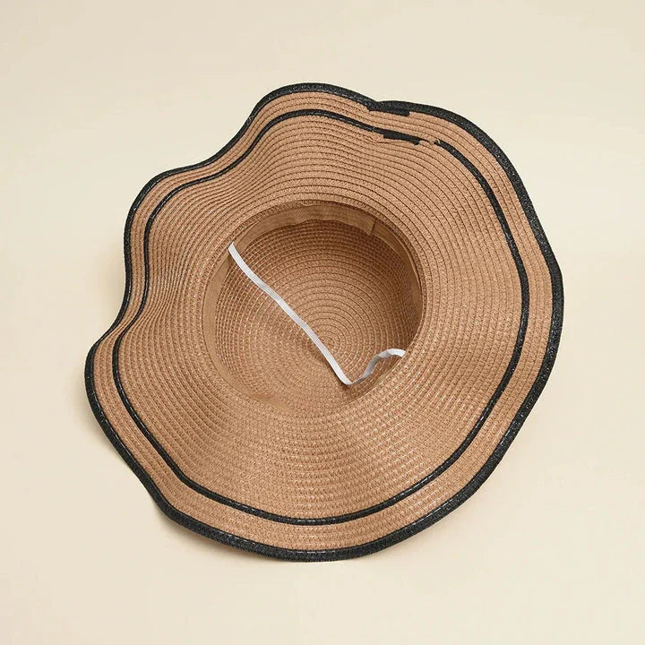 A stylish bowknot straw sun hat providing excellent UV protection and comfort for summer adventures
