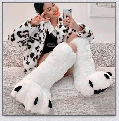 Oversized fluffy white bear claw winter slippers with a cosy and playful design, suitable for adults and kids alike