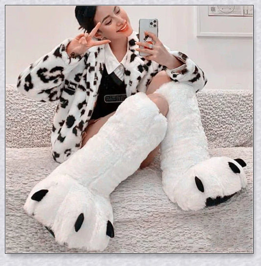 Oversized fluffy white bear claw winter slippers with a cosy and playful design, suitable for adults and kids alike