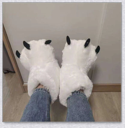 Oversized fluffy white bear claw winter slippers with a cosy and playful design, suitable for adults and kids alike