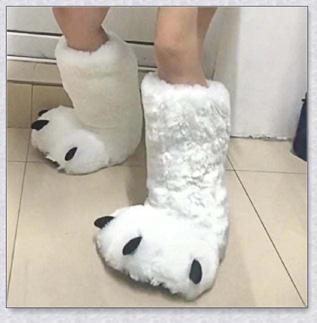 Oversized fluffy white bear claw winter slippers with a cosy and playful design, suitable for adults and kids alike