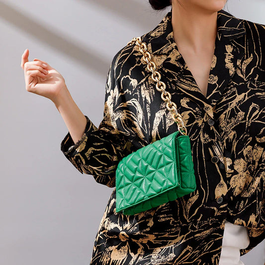 Lingge Small Bag in pink with a large gold chain, a stylish one-shoulder crossbody bag with a quilted design.