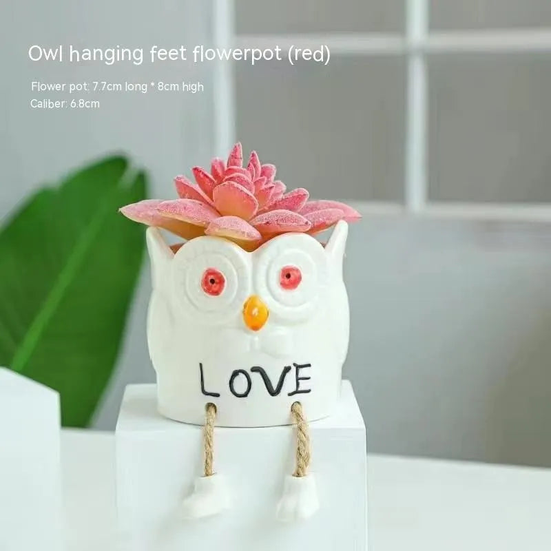 Ceramic hanging foot flowerpot with cartoon design for succulents on desktop