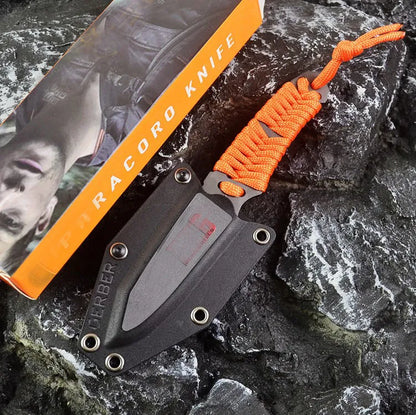 Straight-blade survival knife with a binding rope handle next to its black ABS plastic sheath.