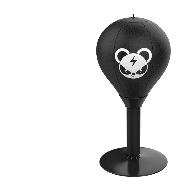 Tabletop boxing speed ball with suction cup base on a desk, showing burst bear design and flexible connection tube