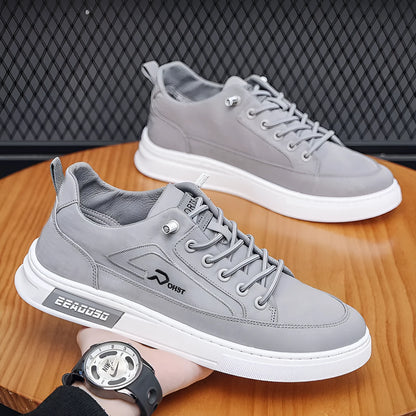 Gray men's canvas casual shoes with ice silk construction, leather lining, and rubber sole in low top design