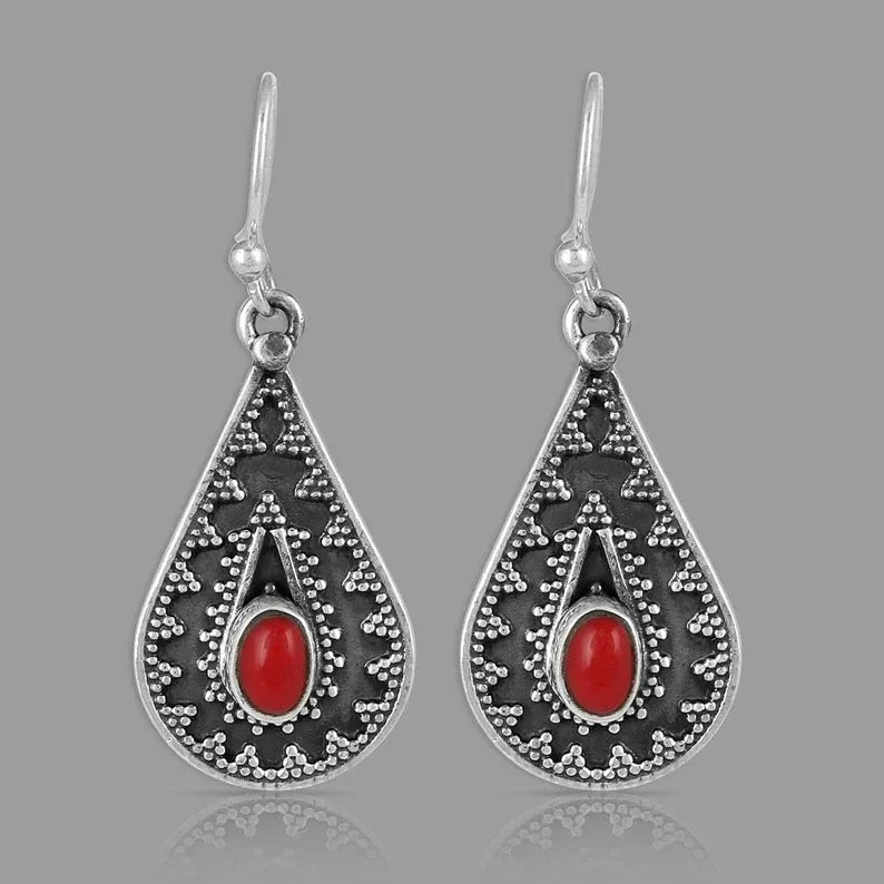 Silver drop-shaped earrings with red pine gemstone details and European American national style design