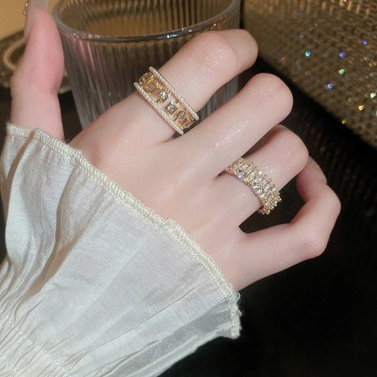 Elegant square ring with hollowed-out design and shimmering zircon stones, perfect for the stylish British woman