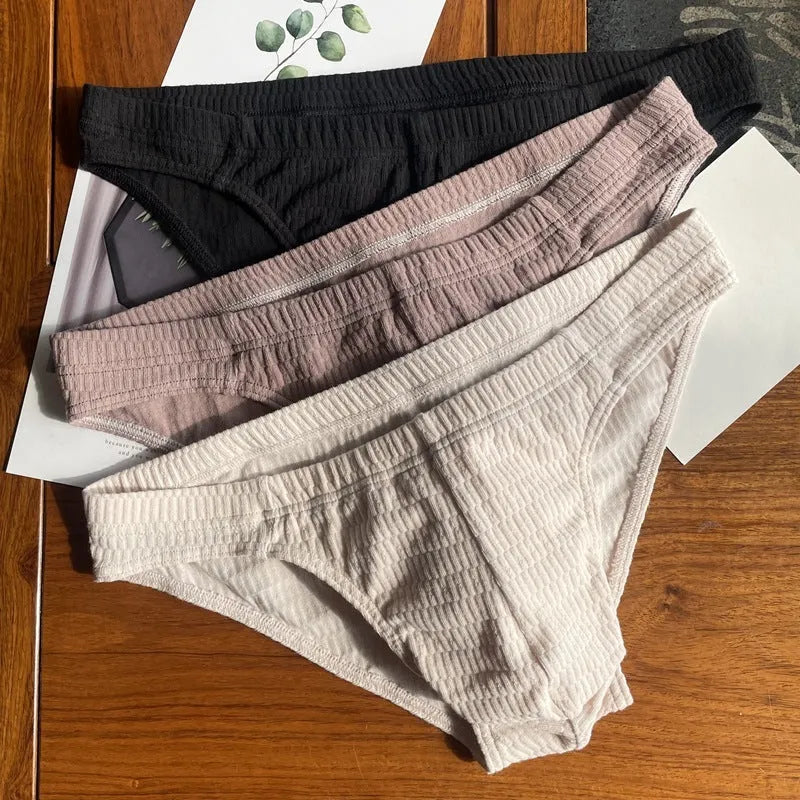 Men's solid colour pure cotton triangle underwear briefs on a mid-waist fit model