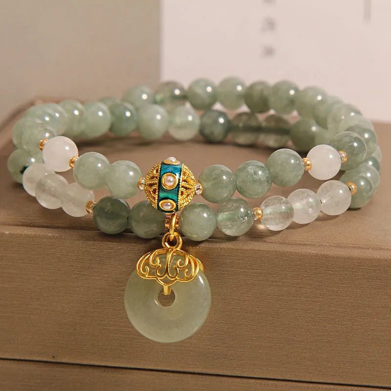Women's aventurine double-layer jade bracelet with peace buckle closure and rhinestone details