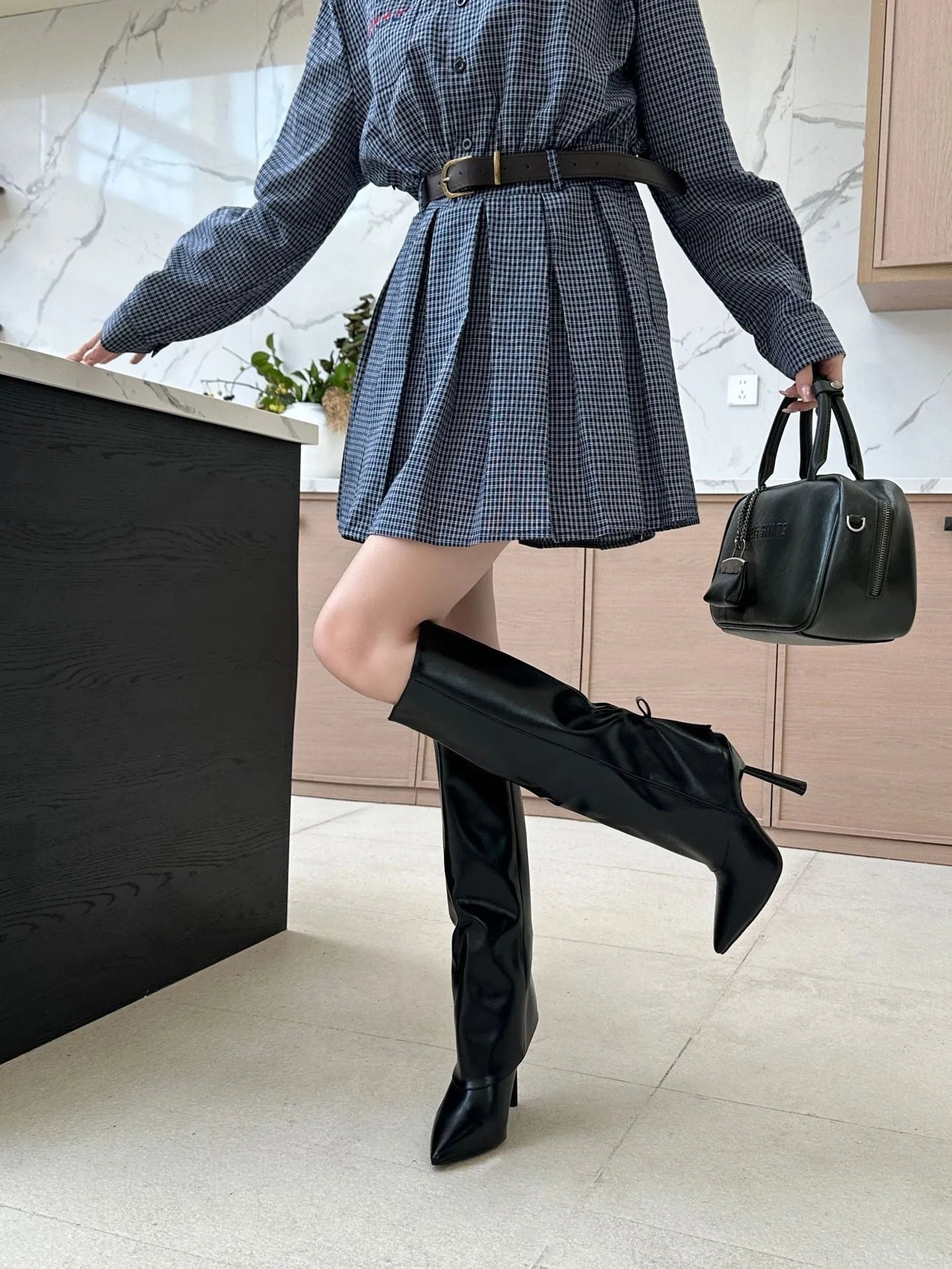 Black women's high-heel boot cover with stiletto heel and over-the-knee length