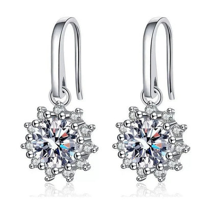 Elegant white gold sunflower stud earrings with a lustrous finish, a versatile accessory for the modern British woman