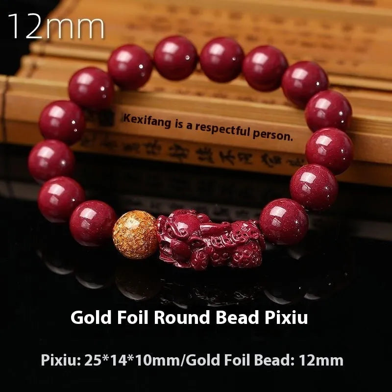 Purple gold sandstone cinnabar bracelet with totem design on a wrist, showing polished beads.