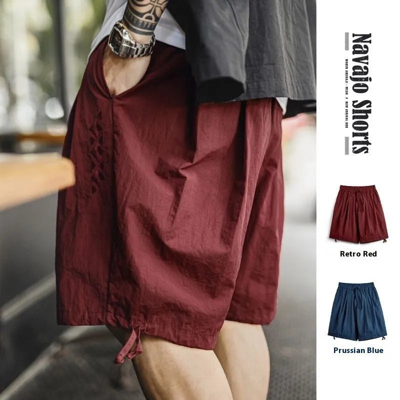 Men's Prussian Blue nylon beach shorts with embroidery and loose fit