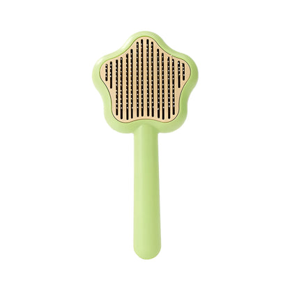 Green and yellow stainless steel self-cleaning cat comb for de-shedding, measuring 20cm.