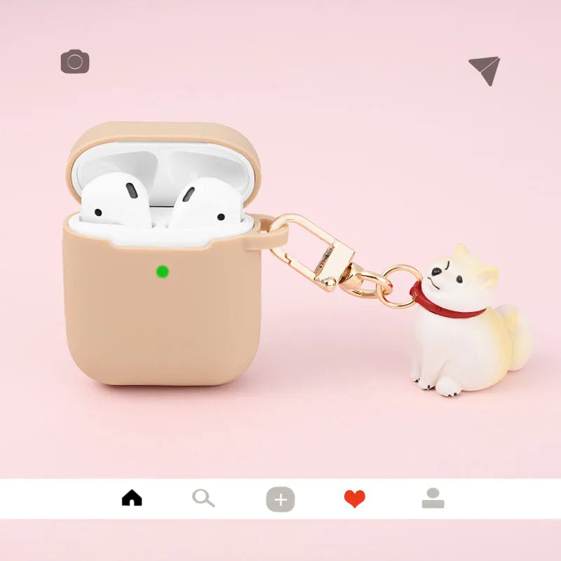 Silicone AirPods case with Shiba Inu pendant in yellow, white, or black, universal fit for AirPods 1 and 2.