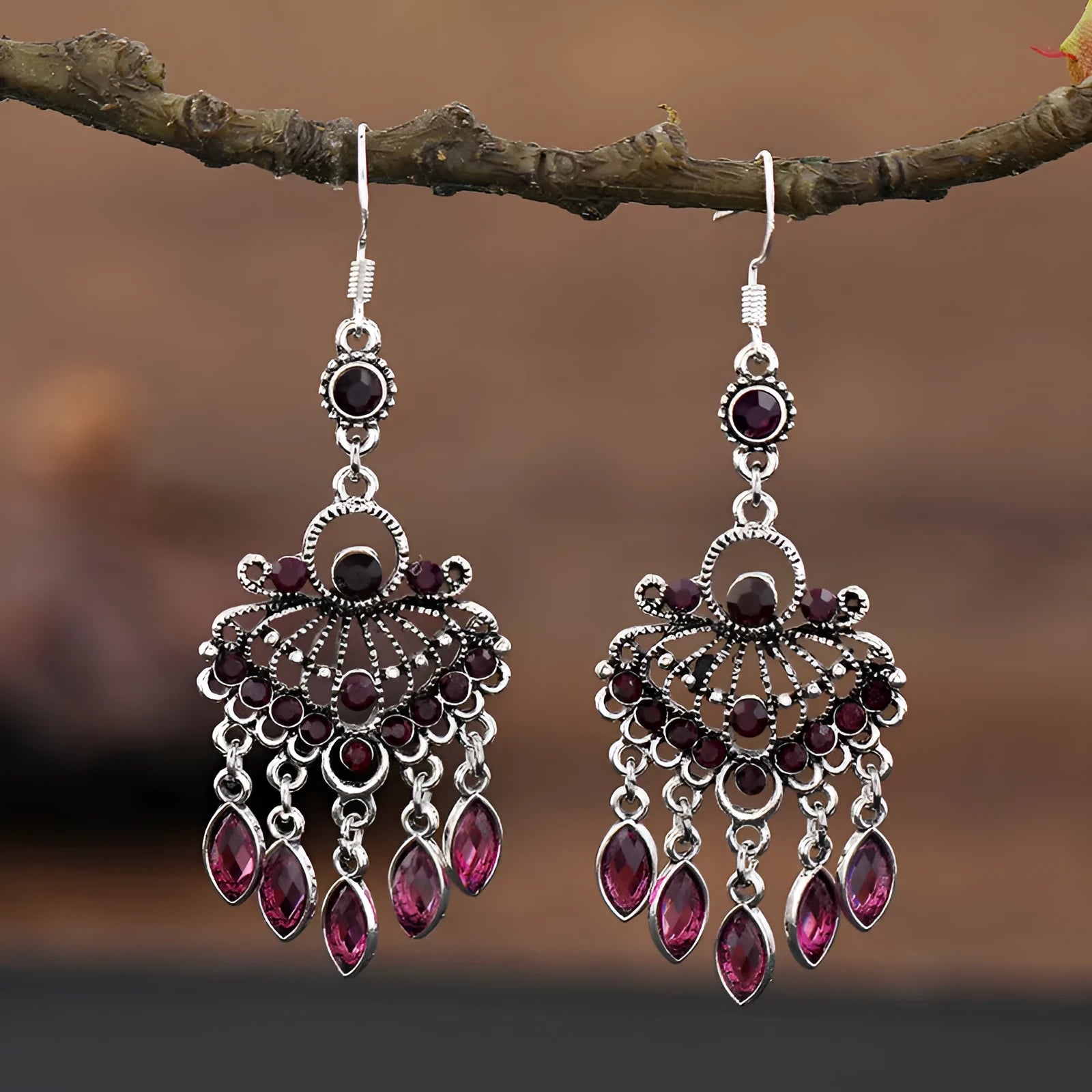 Purple drop-shaped alloy earrings with long fringe and crystal details on a retro style.
