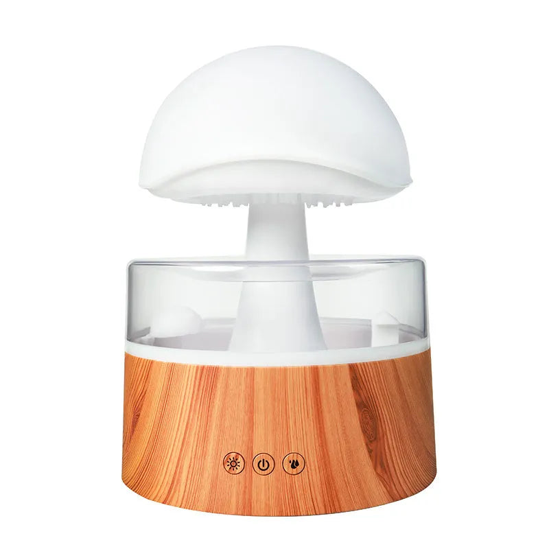 White cloud-shaped humidifier emitting mist with multicoloured LED light and water droplets