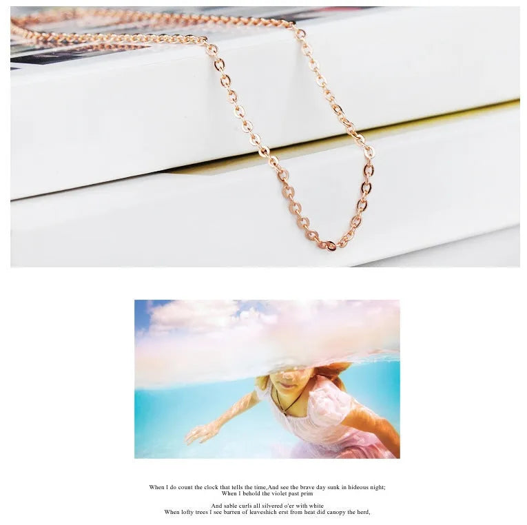 Women's rose gold heart-shaped pendant necklace with pink crystal centre on cross chain