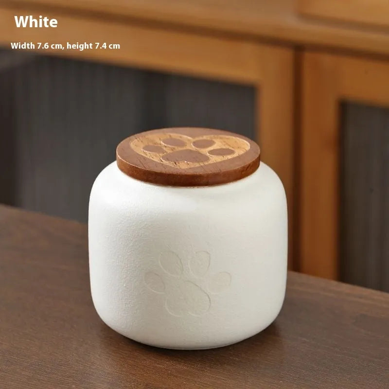 Ceramic pet funeral urn with foot print design in choice of colours and 180ml or 500ml sizes