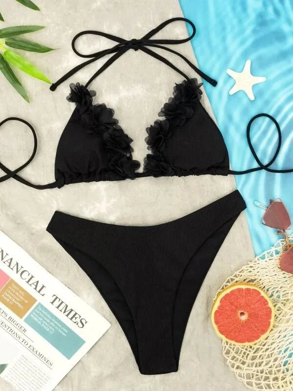 Black two-piece swimwear set with gathered top design and matching shorts