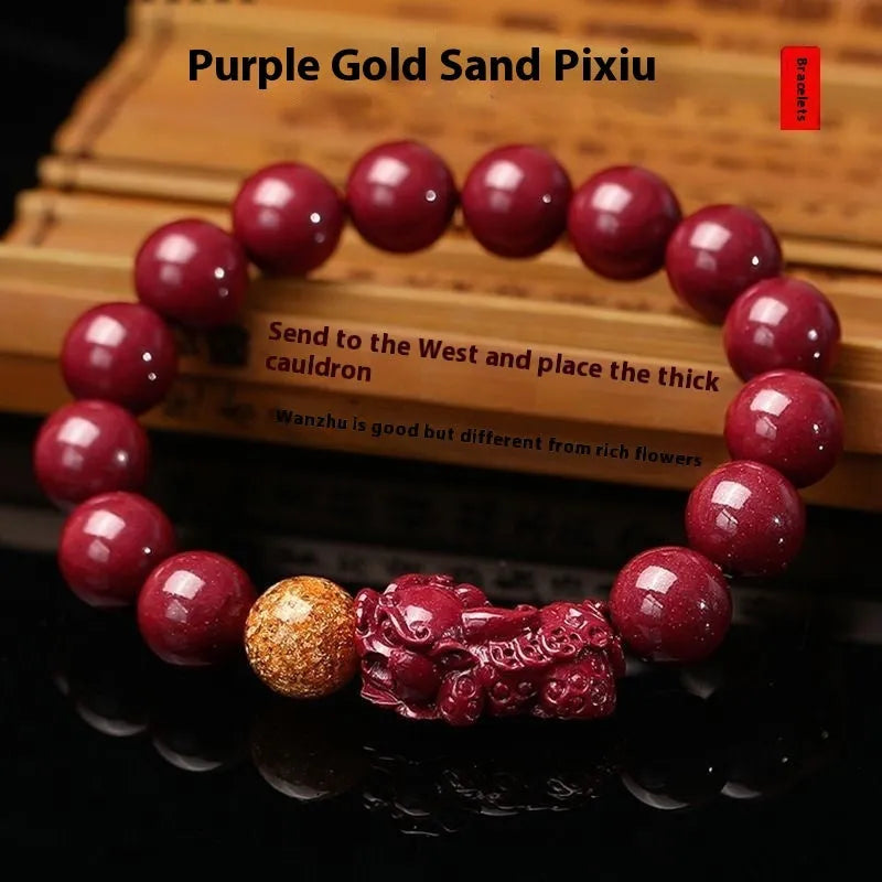 Purple gold sandstone cinnabar bracelet with totem design on a wrist, showing polished beads.