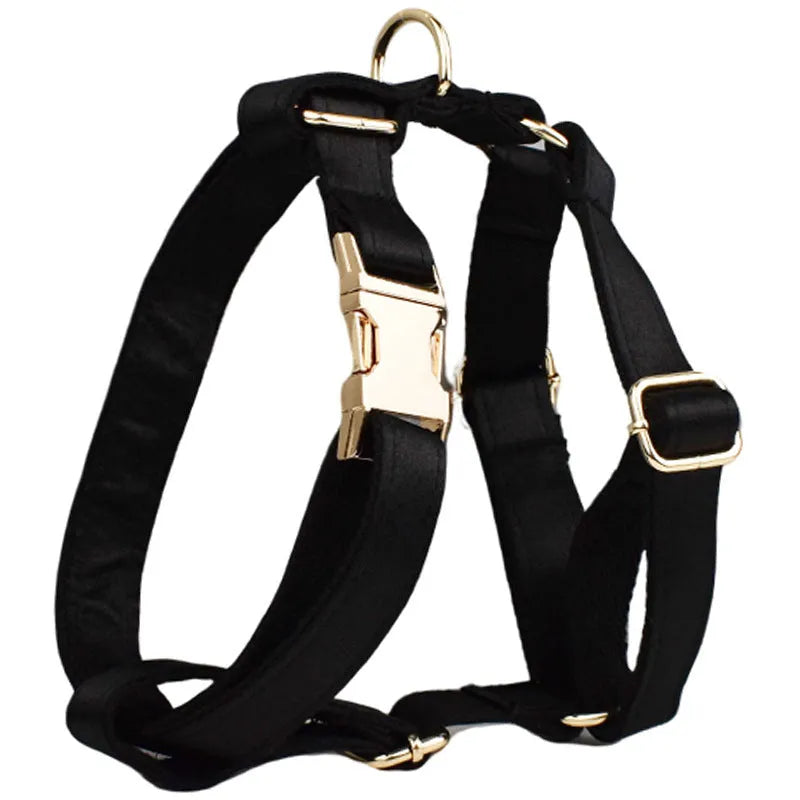 Cloth dog collar and leash set with chest strap harness, adjustable vest, and decorative bow.