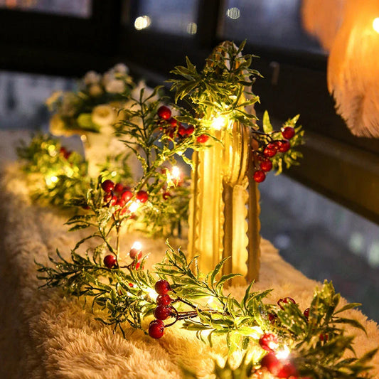 Festive Christmas fairy lights with leaf shapes and crimson berries, creating a warm, enchanting glow