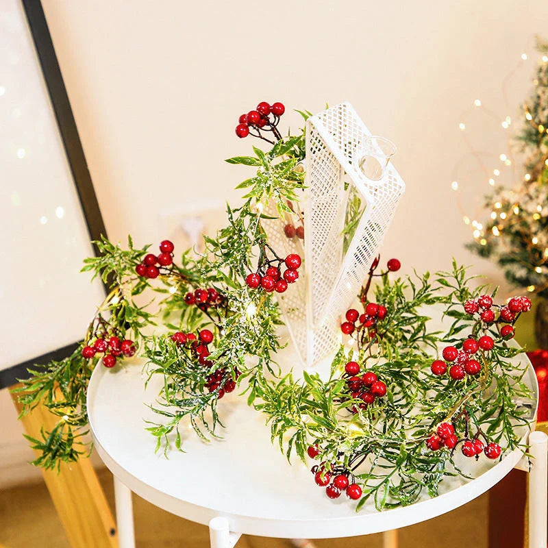 Festive Christmas fairy lights with leaf shapes and crimson berries, creating a warm, enchanting glow