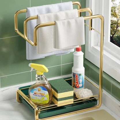 Gold wall mounted sponge holder with removable drip tray holding brushes and soap
