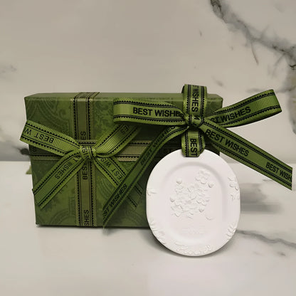 Car aromatherapy fragrant stone pendant with essential oil bottle on gift box
