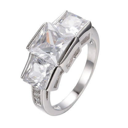 Aier Moxa geometric copper fashion ring in assorted electroplated colours on a plain background.