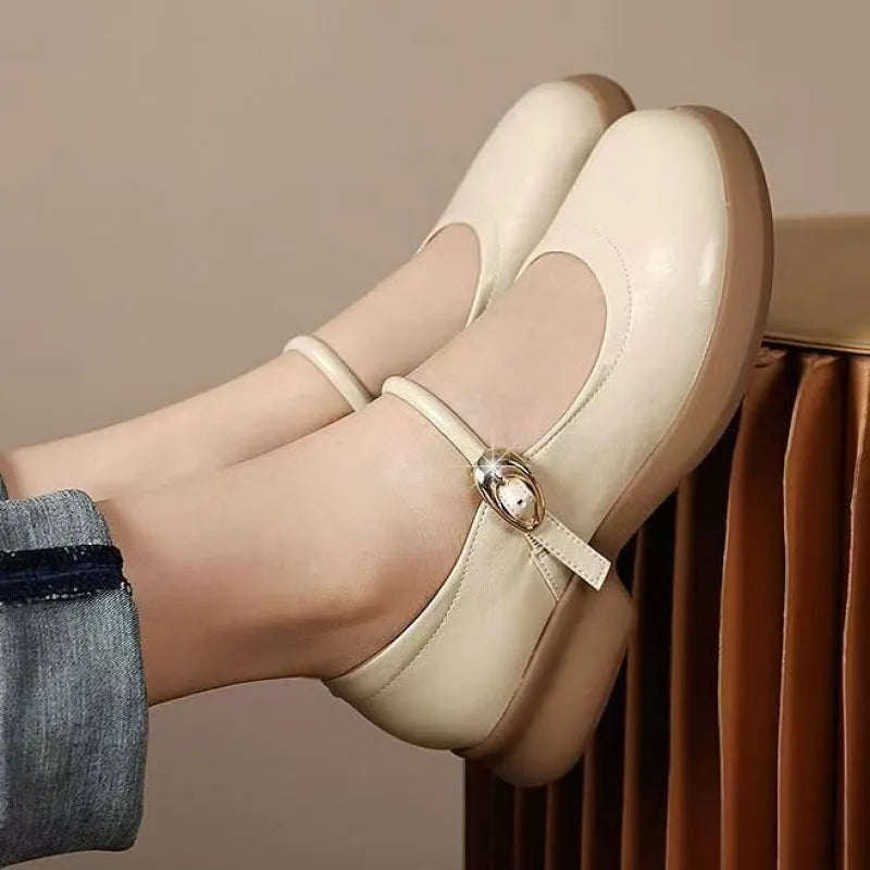 Flat leather shoes with wedge heel in black, featuring a skull pattern, round toe, and rubber sole.