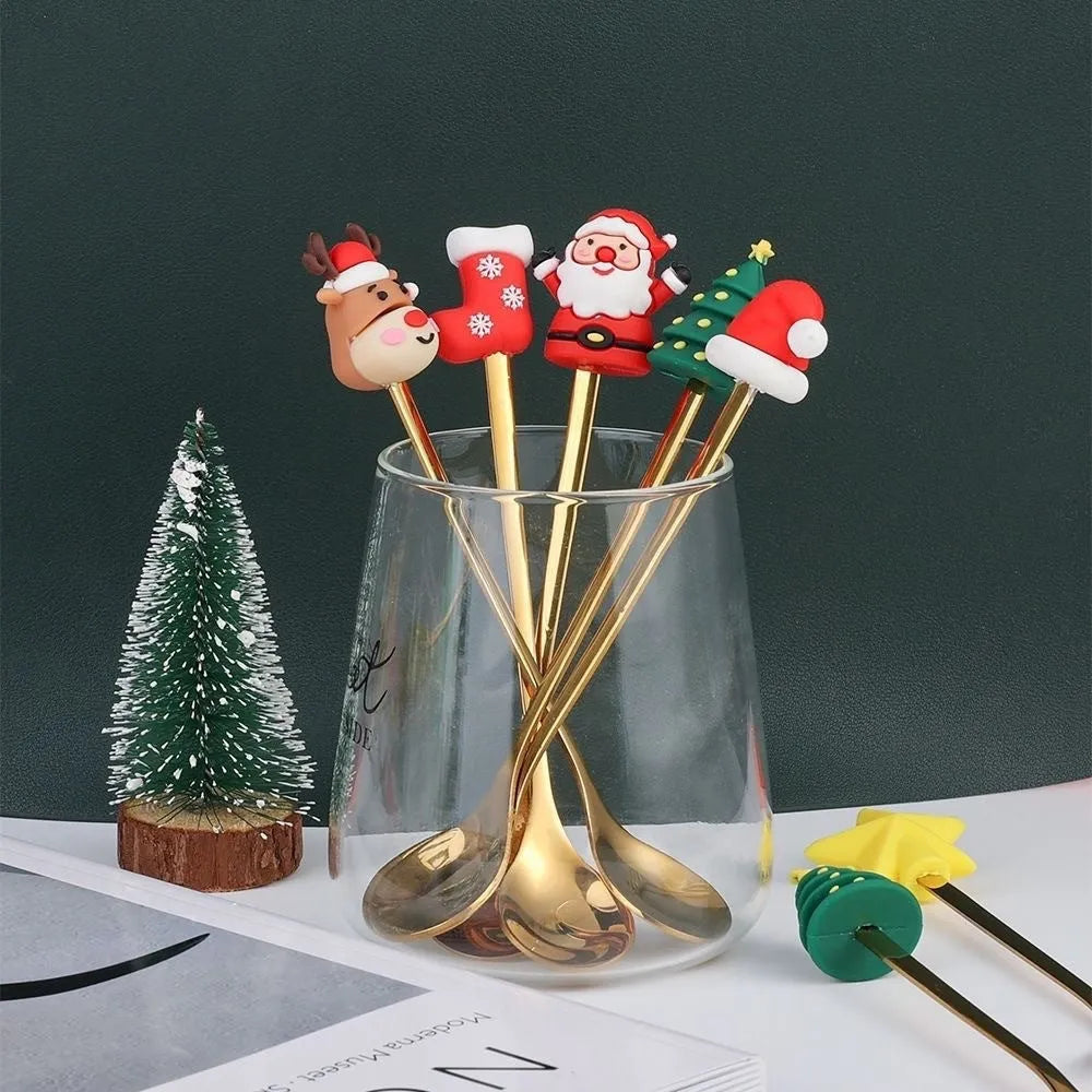 Red-handled stainless steel Christmas spoons and forks with snowman and tree designs.