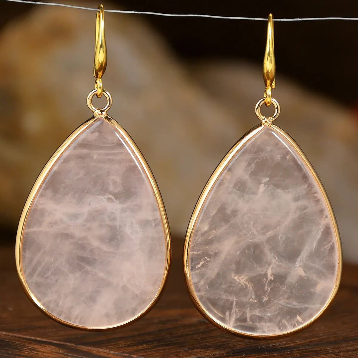 Women's retro-style drop earrings with a natural stone pendant in a water drop shape on an electroplated setting.