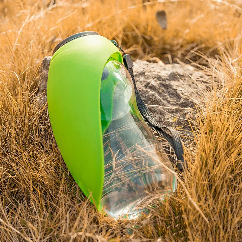 Blue portable pet water bottle with drinking bowl for dogs, showing 680ml capacity and hanging attachment
