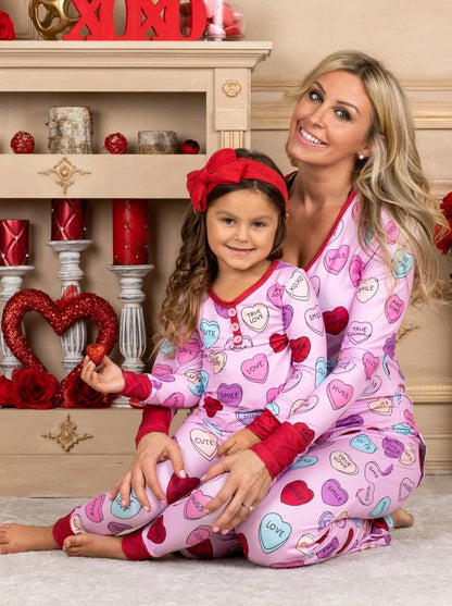 Adorable heart-printed family pajamas with long-sleeve tops and full-length bottoms in a range of sizes for children and adults.
