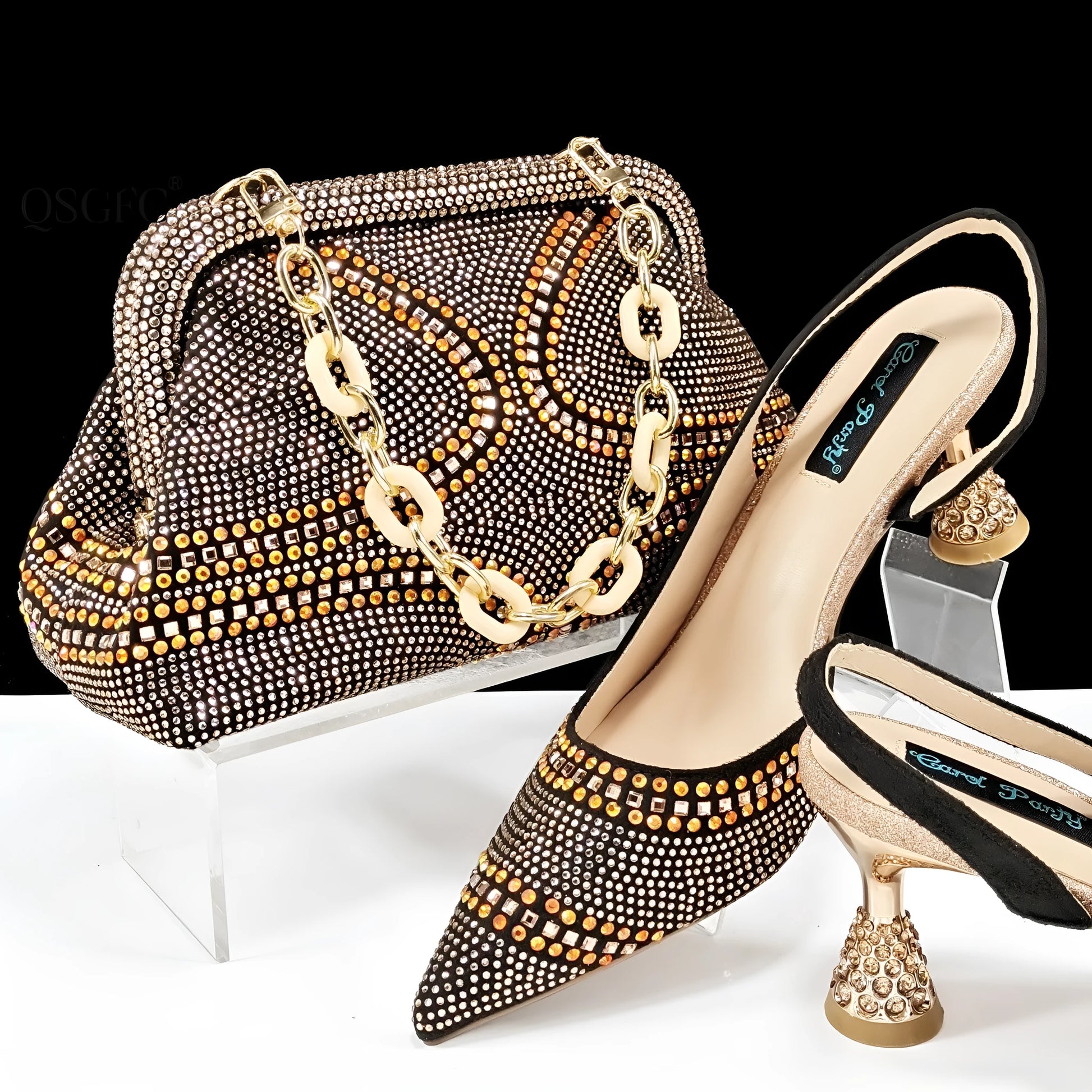 Women's pointed toe high heels with rhinestones and a matching small bag in blue.